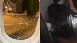 Gruaja e dehur thyen xhamin e aeroplanit