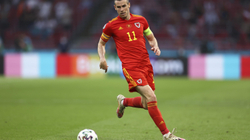Bale ia siguron një pikë Uellsit në rikthimin në Botëror