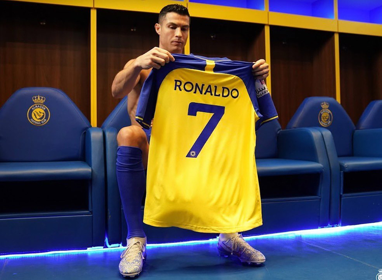 Cristiano Ronaldo holds Al Nassr no7 jersey after contract signed