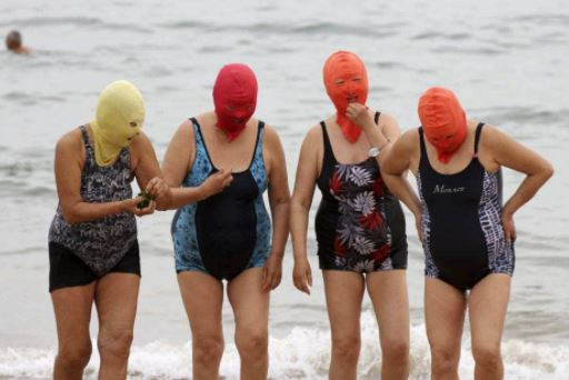 Ready for a facekini? Hideous full-face lycra masks cramp the style of fair  complexions in China