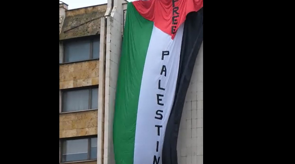 The Palestinian flag is placed and then removed in the Grand building ...