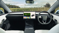 Tesla's glass reduces the intensity of outside noise, the car company says.