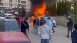 A car burns on "Muharrem Fejza" street in Pristina