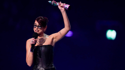 Dua Lipa receives an award at the "Brit Awards"